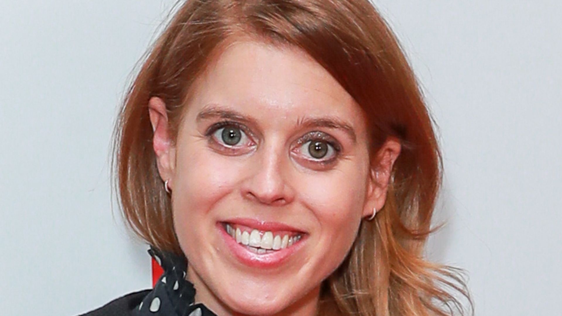 Princess Beatrice's tumbling red hair is amazing with this high-fashion jacket