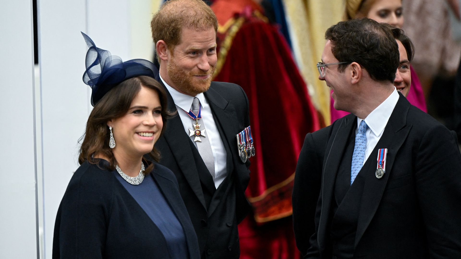 Prince Harry chatting with Princess Eugenie and Jack Brooksbank at coronation