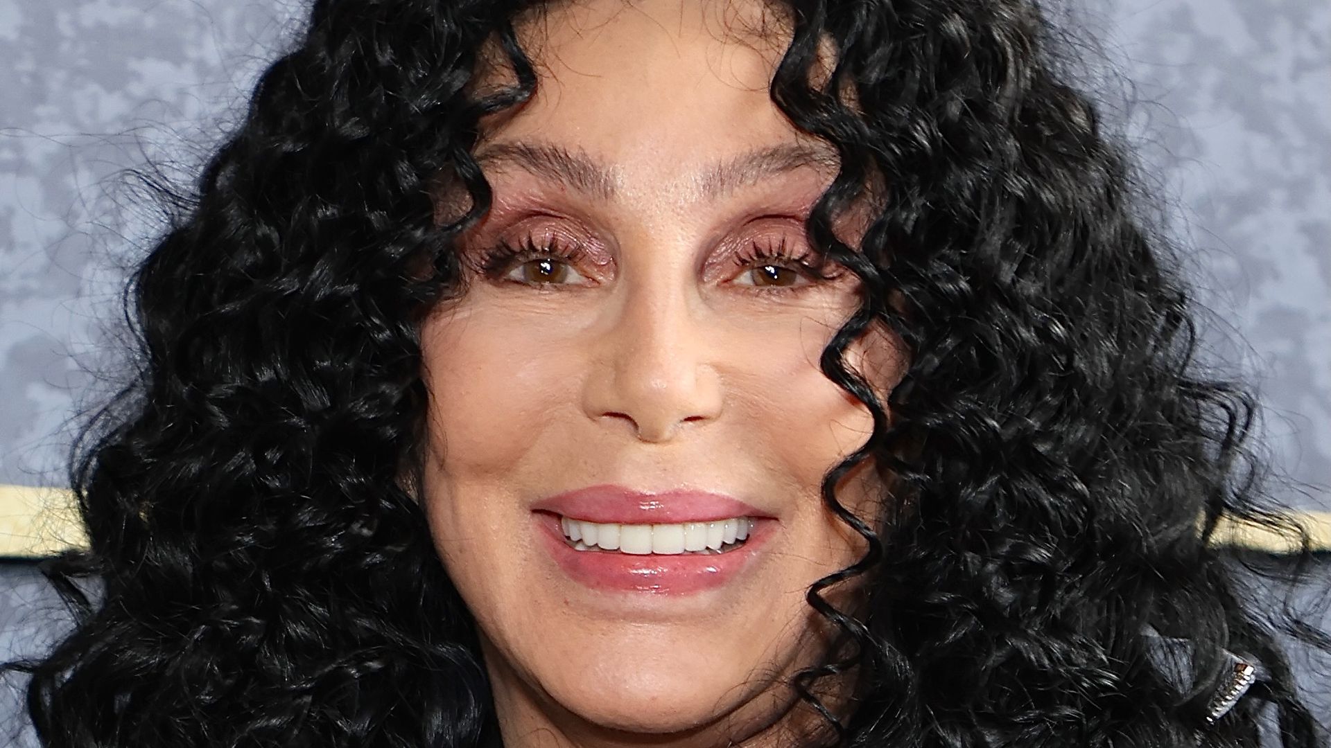 Cher with black curls