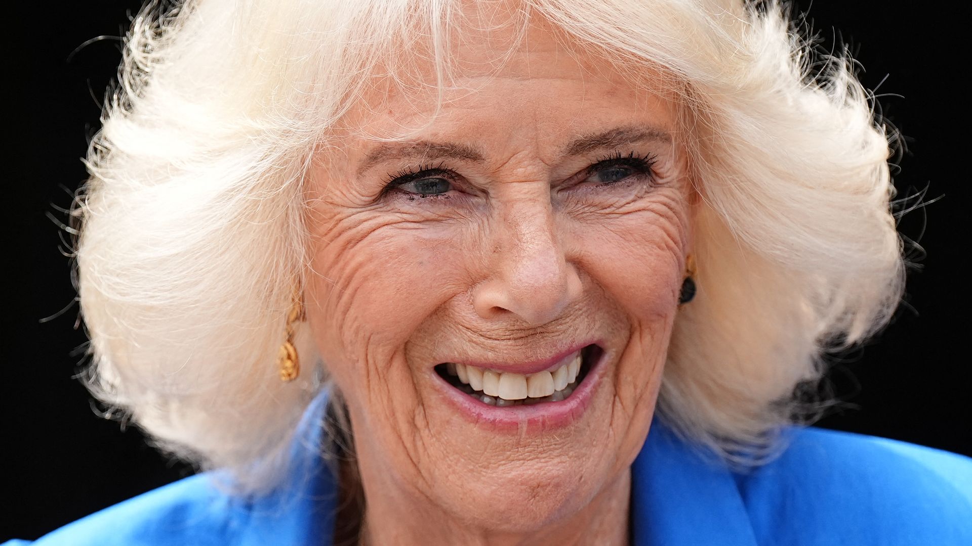 Queen Camilla cuddles adorable rescue dog Moley at ultra-private home