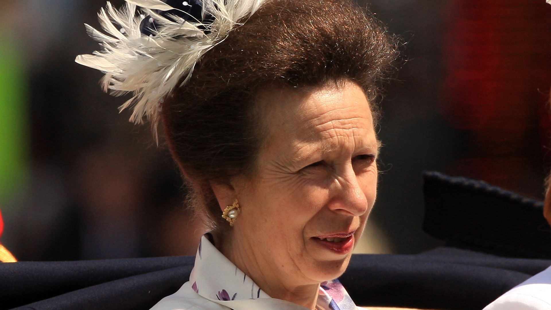Princess Anne goes bold in white waist-defining mother-of-the-groom dress