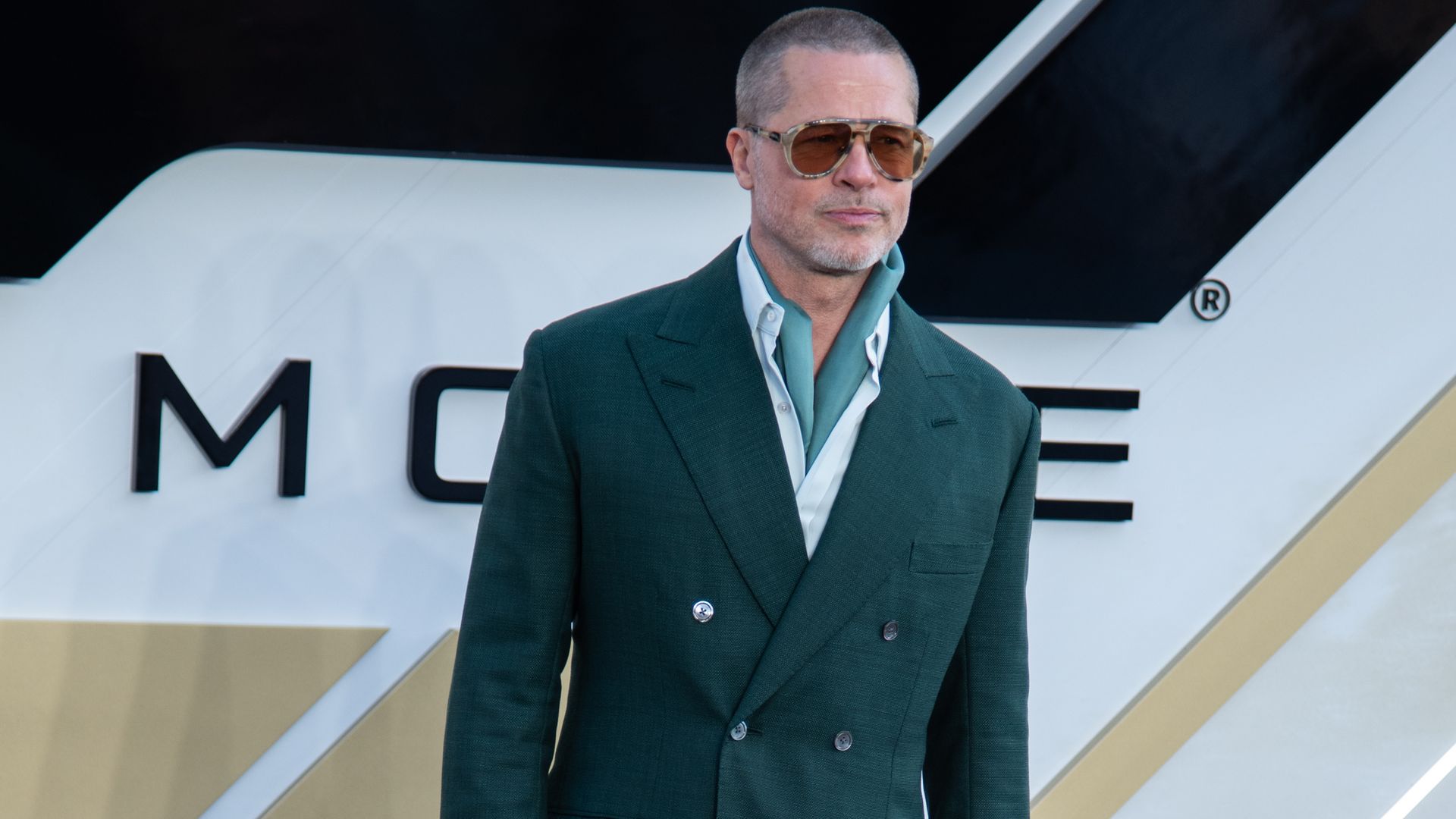 Brad Pitt attends the 'F1: The Movie' European Premiere at Cineworld Leicester Square in green suit