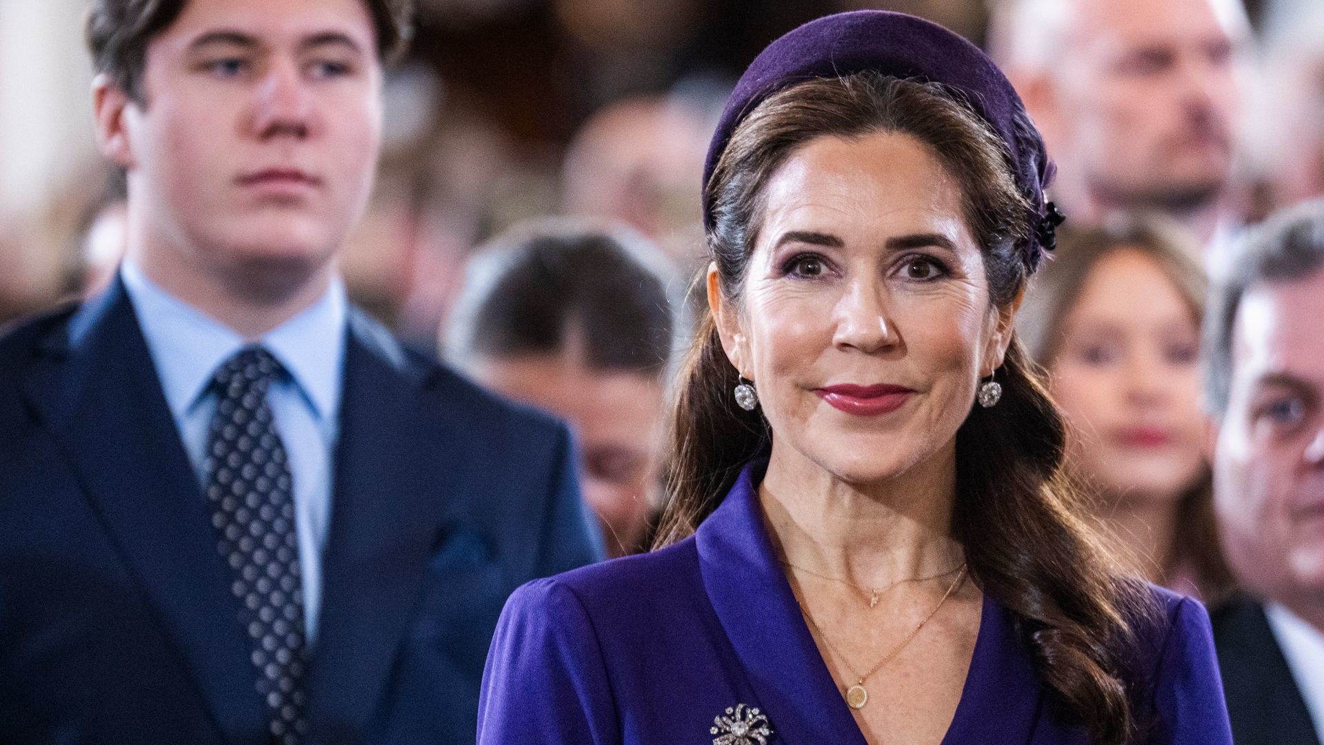 Queen Mary of Denmark is a vision in purple for church service with ...