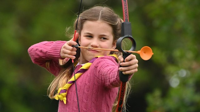 ONDON, ENGLAND - MAY 08: Princess Charlotte of Wales tries her hand at archery while taking part in the Big Help Out, during a visit to the 3rd Upton Scouts Hut in Slough on May 8, 2023 in London, England. The Big Help Out is a day when people are encoura