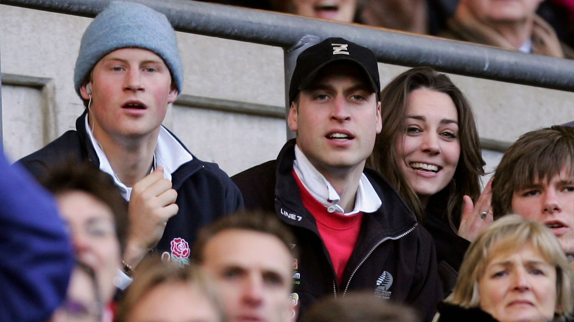 Prince Harry (L) and Prince William (C) and Kate Middleton (R) watch the action during the RBS Six Nations Championship match between England and Italy at Twickenham on February 10, 2007 in London, England.  (Photo by Richard Heathcote/Getty Images)