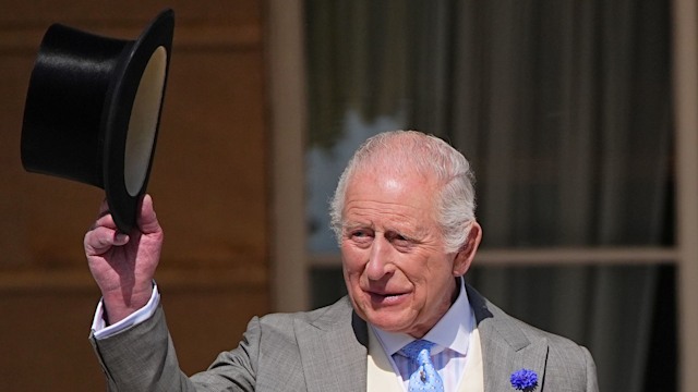 King Charles tipping his top hat