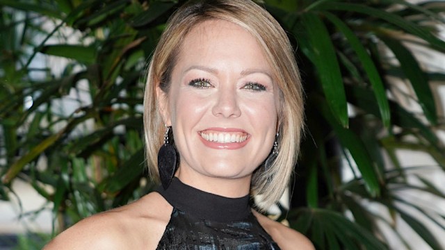 Dylan Dreyer in a halterneck top and skirt in front of a plant