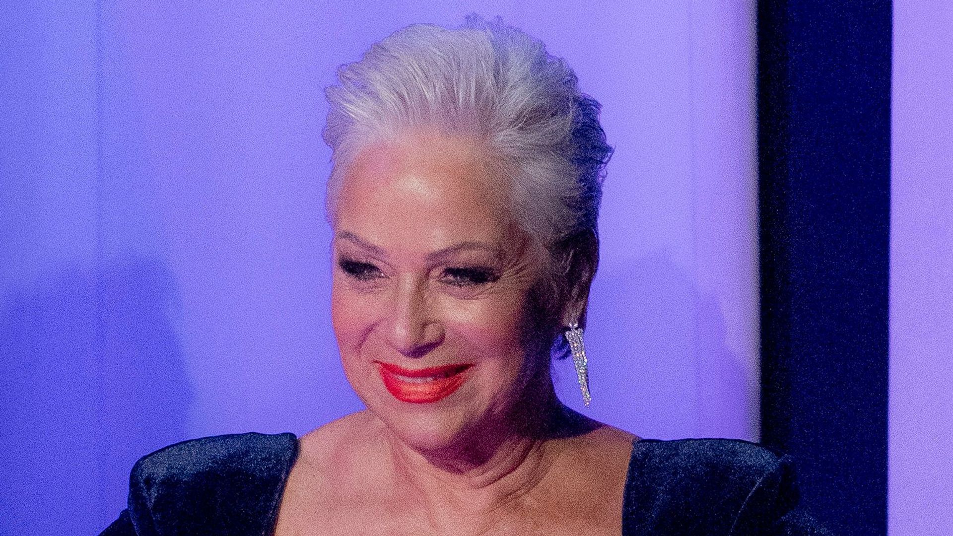 Denise Welch, 65, wows in plunging swimsuit and cowboy boots