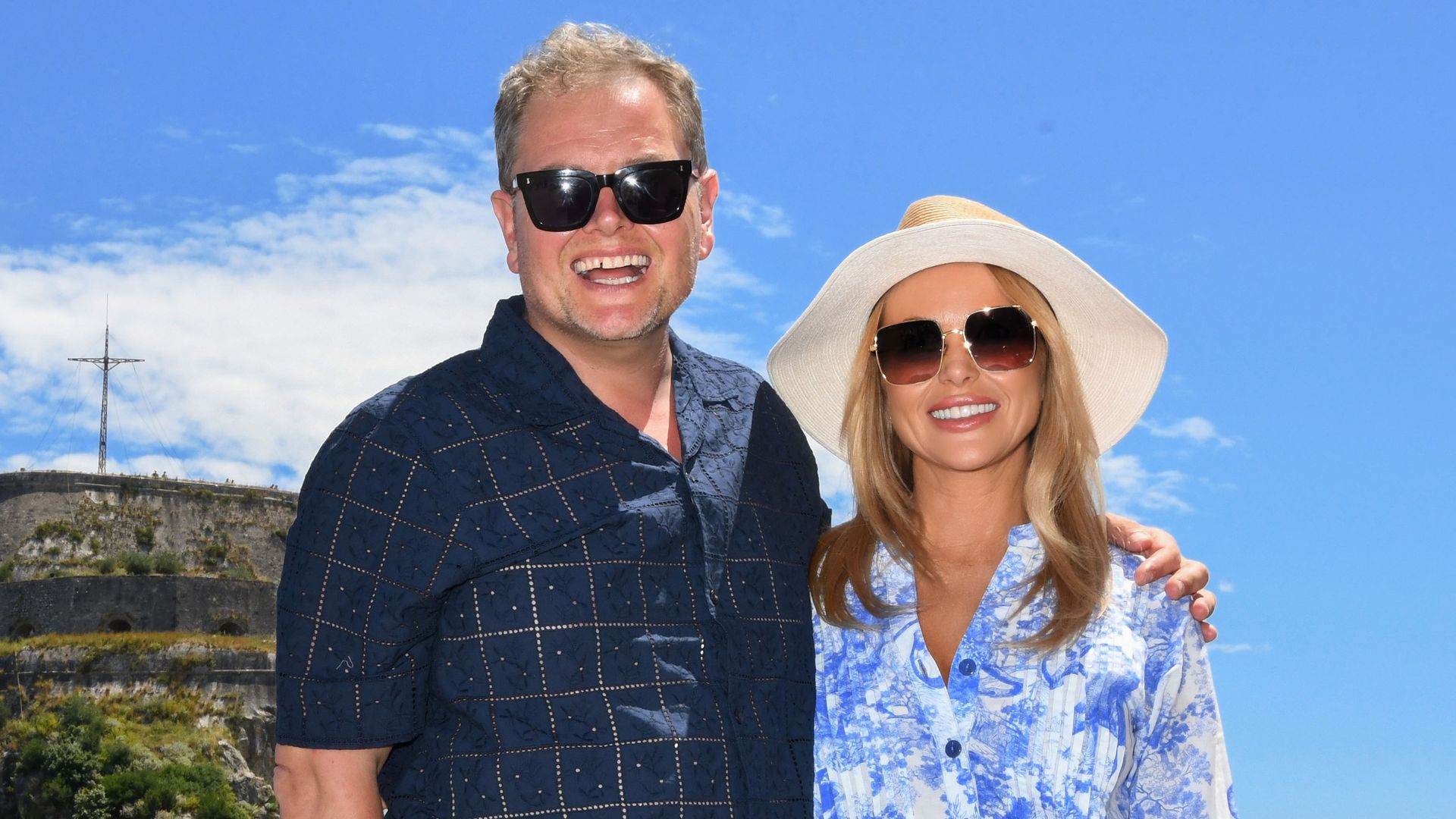 Amanda Holden wearing a blue and white floral dress on Amanda & Alan's Greek Job