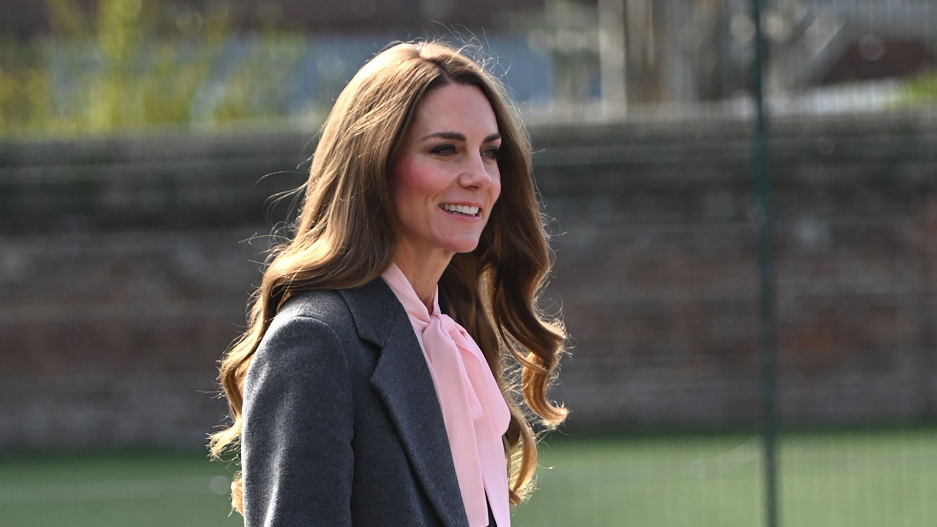 Kate Middleton arriving in Southport in grey coat and pink blouse