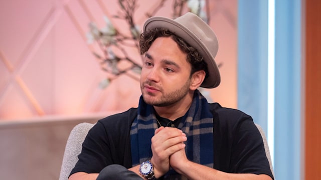 Adam Thomas in hat and scarf