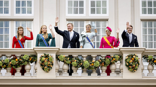 Princess Alexia of the Netherlands, Princess Amalia of the Netherlands, King Willem-Alexander of the Netherlands, Queen Maxima of the Netherlands, Princess Laurentien of the Netherlands and Prince Constantijn of the Netherlands wave to bystanders from the balcony of Noordeinde Palace