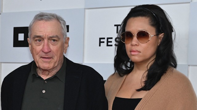 Robert De Niro and his girlfriend Tiffany Chen arrive to the screening of "Kiss the Future" during the opening night of the Tribeca Film Festival 