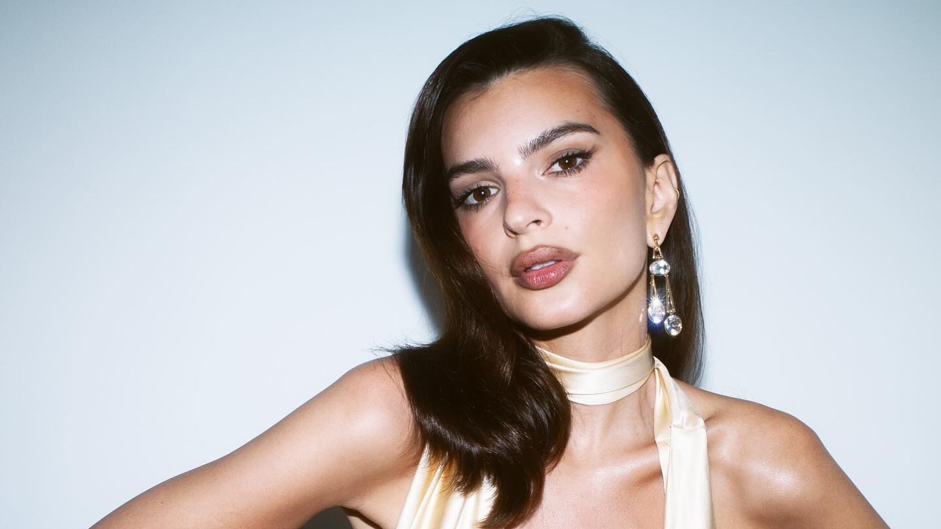 Emily Ratajkowski poses in a plunging dress on her Instagram