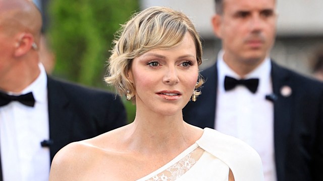 Princess Charlene in jumpsuit featured sheer lace cutouts