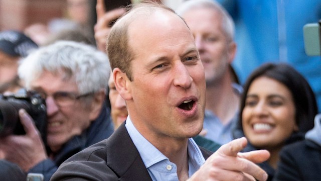 Prince William pointing and laughing