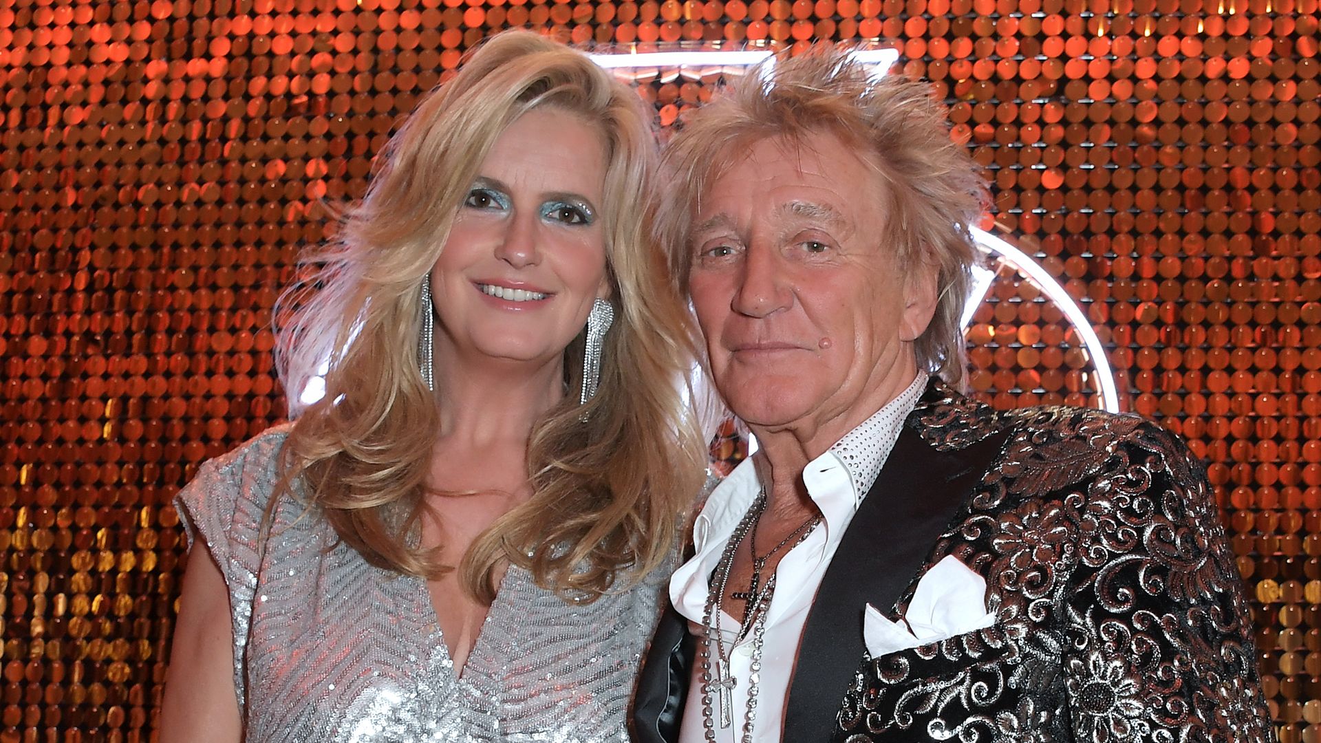 Penny Lancaster and Sir Rod Stewart in glitzy outfits