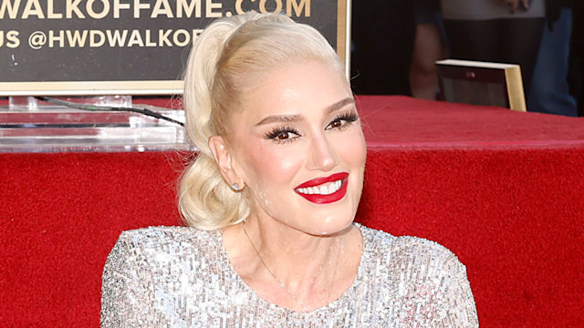 Gwen Stefani poses with her star during her Hollywood Walk of Fame Star Ceremony on October 19, 2023 in Hollywood, California