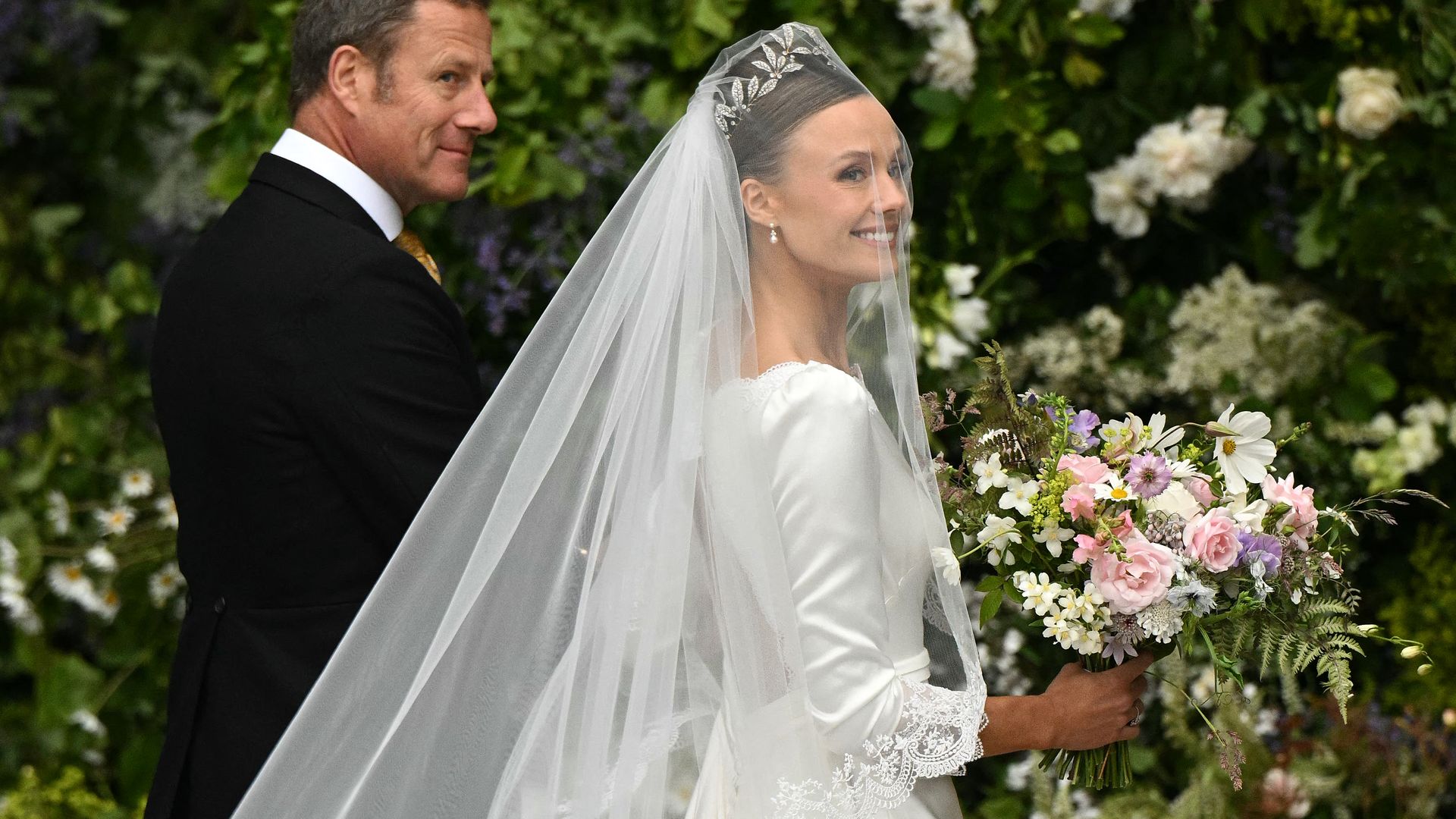 Olivia Henson arrives to attend her wedding to the Duke of Westminster, at Chester Cathedral in Chester, northern England on June 7, 2024. (Photo by Oli SCARFF / AFP) (Photo by OLI SCARFF/AFP via Getty Images)