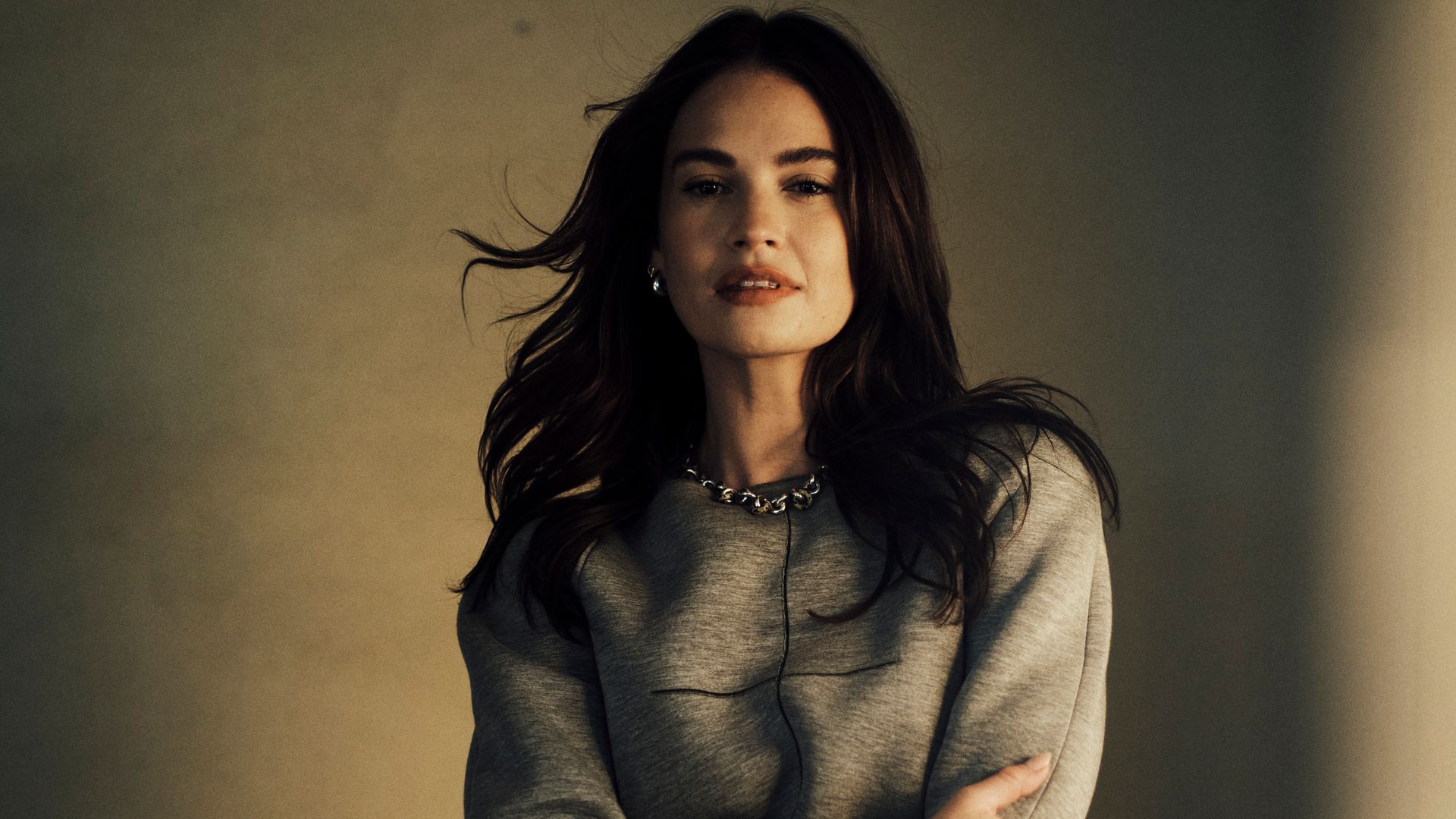 Lily James radiates after-dark romance in silky négligée dress