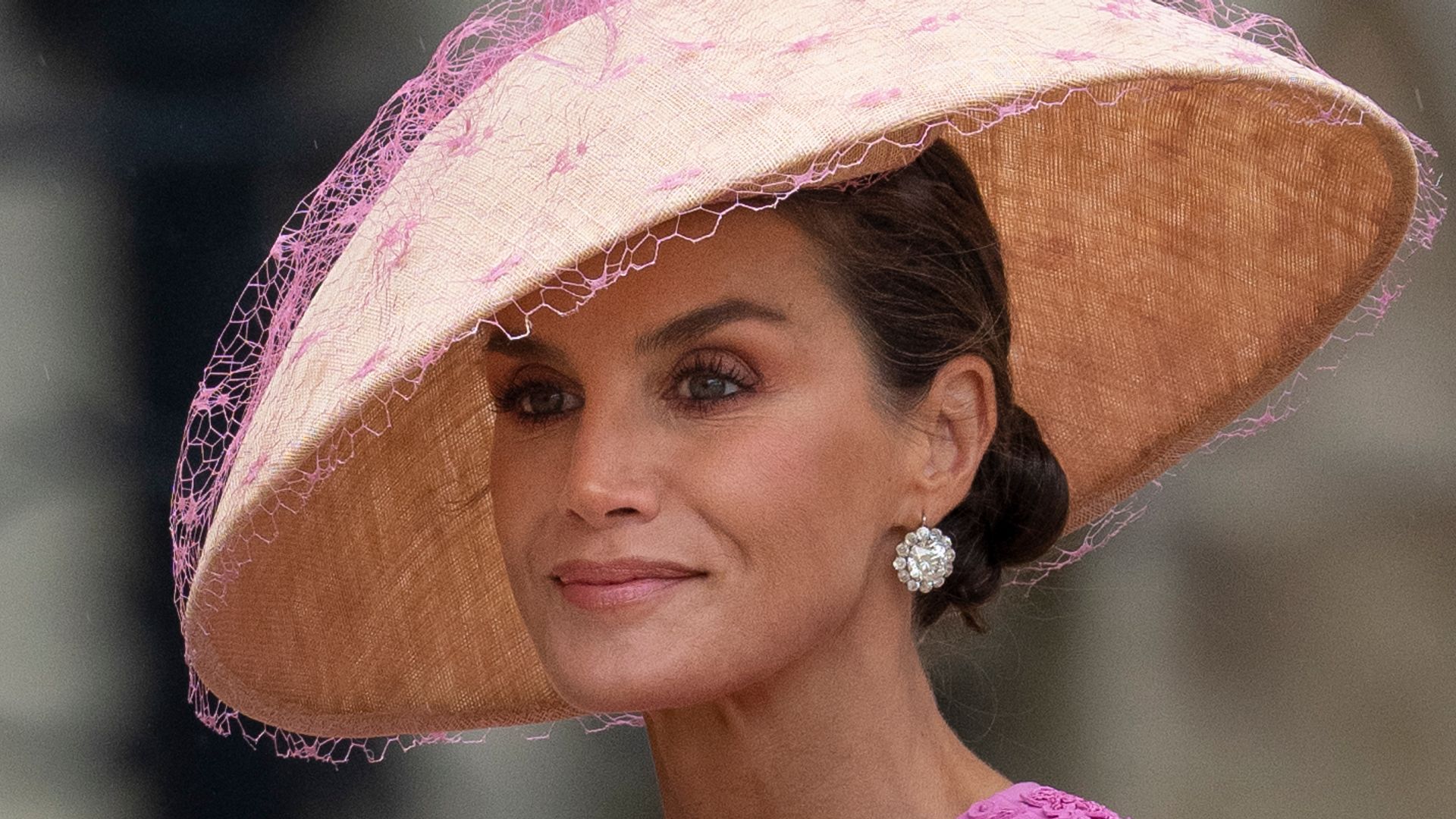 Queen Letizia of Spain in pink outfit and hat