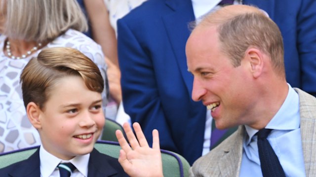 father and son watching tennis match