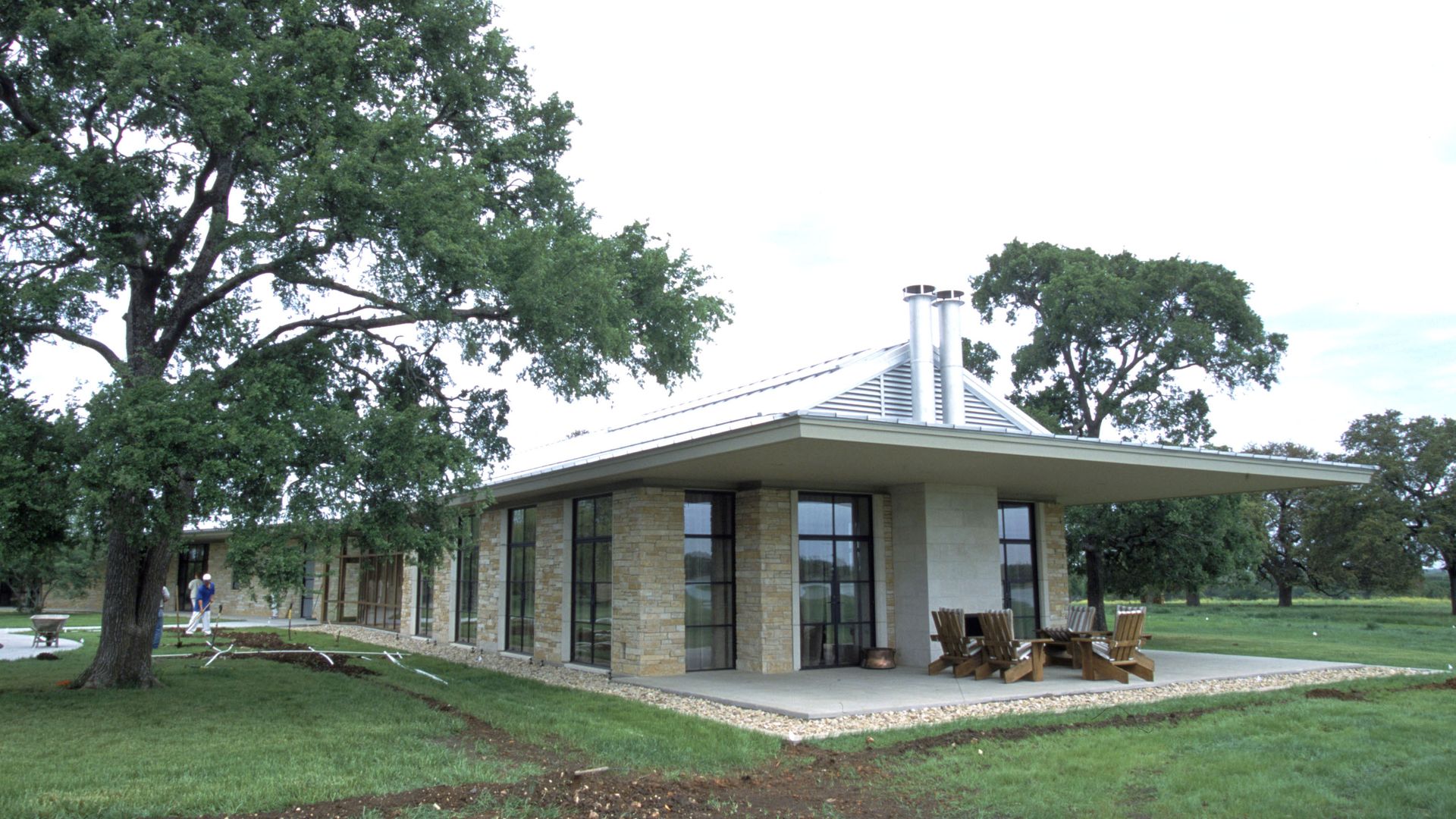 Wokers do grounds-keepng around the home of President George W. Bush and family at their "Prairie Chapel Ranch" April 11, 2001 in Crawford, TX.