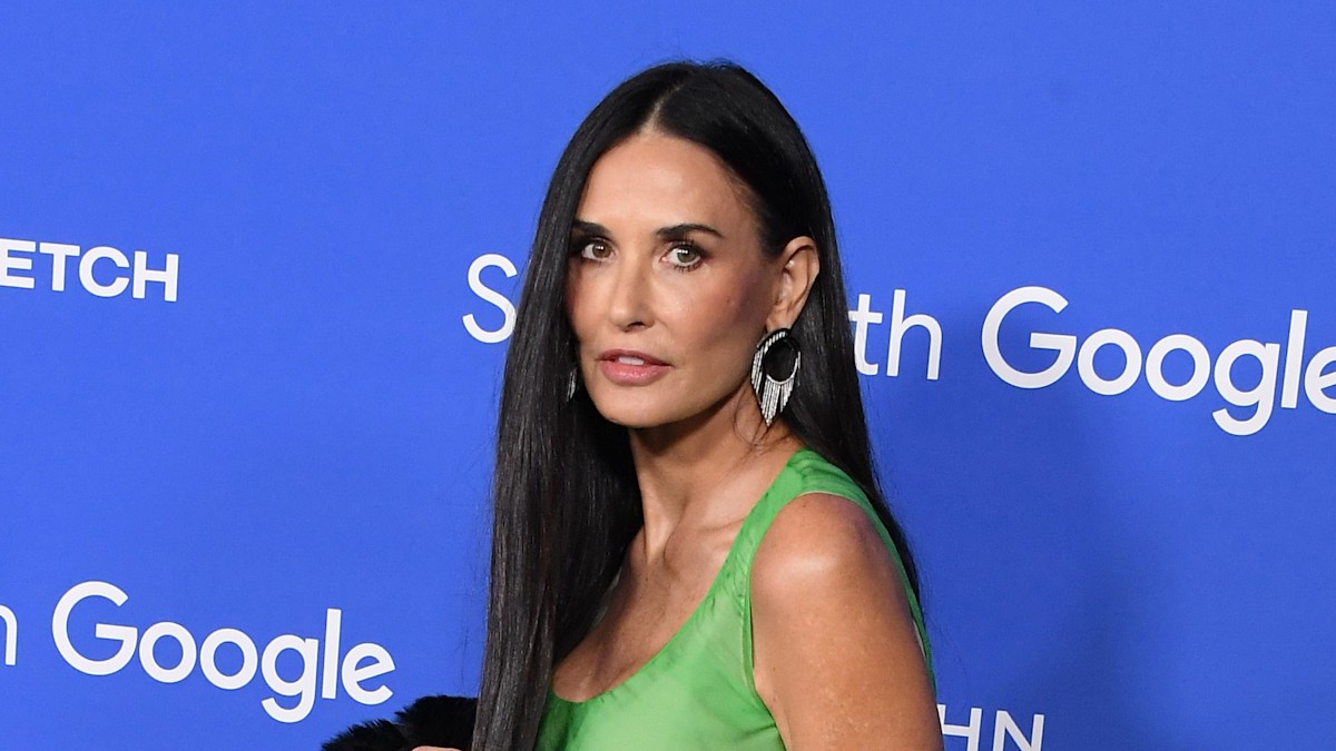 Demi Moore poses in leopard-print string bikini with baby granddaughter ...