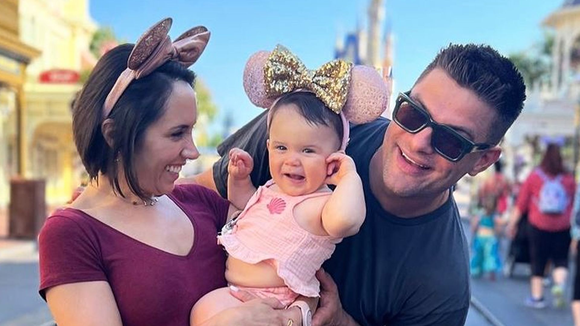 Janette Manrara, Aljaz Skorjanec and Lyra smile for photo at Disneyland