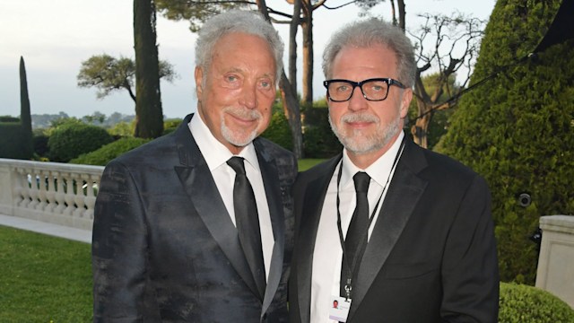 Tom Jones and son Makr in black suits