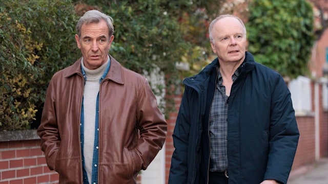 two men walking down street