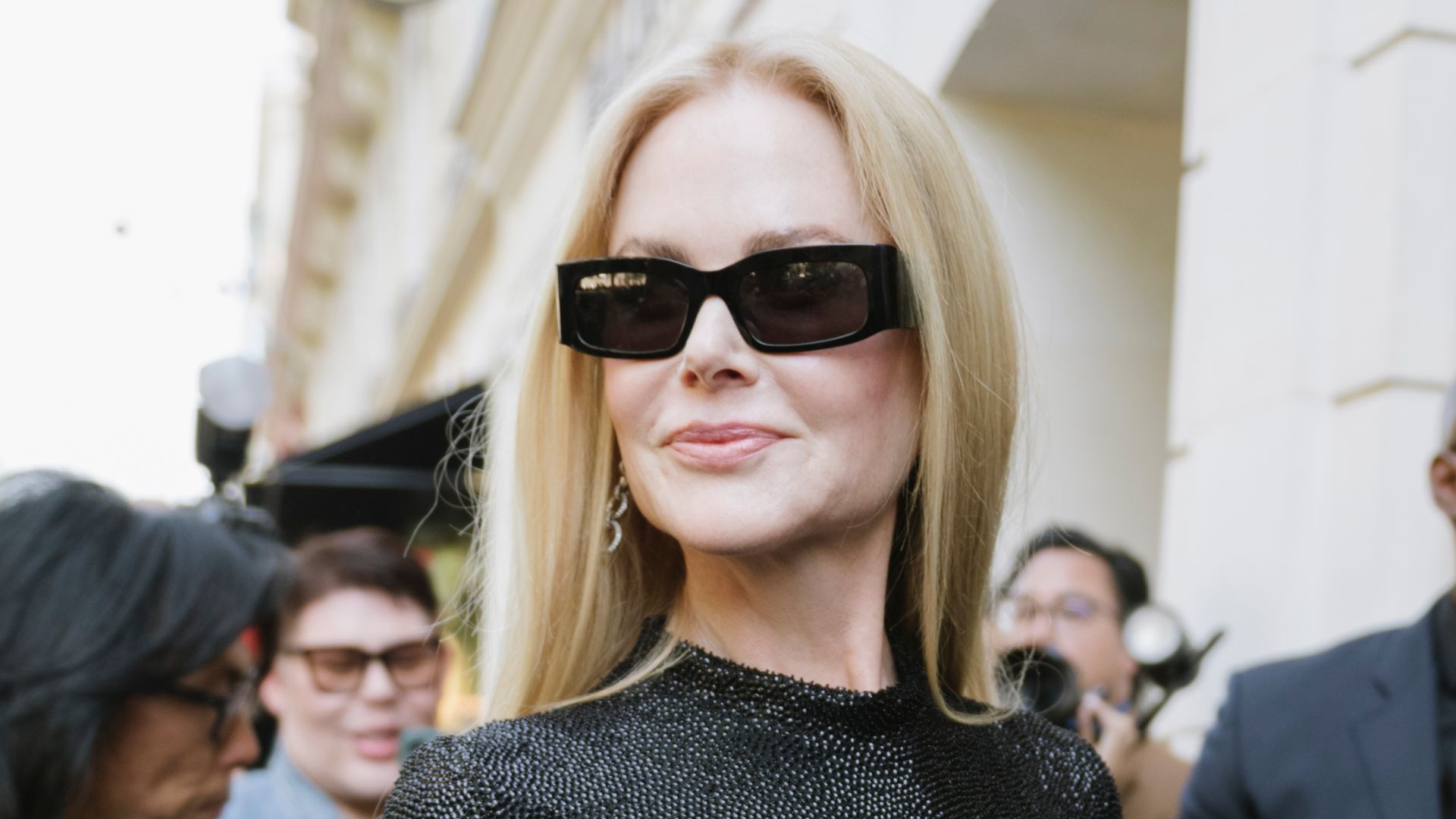 Nicole Kidman in black dress and sunglasses