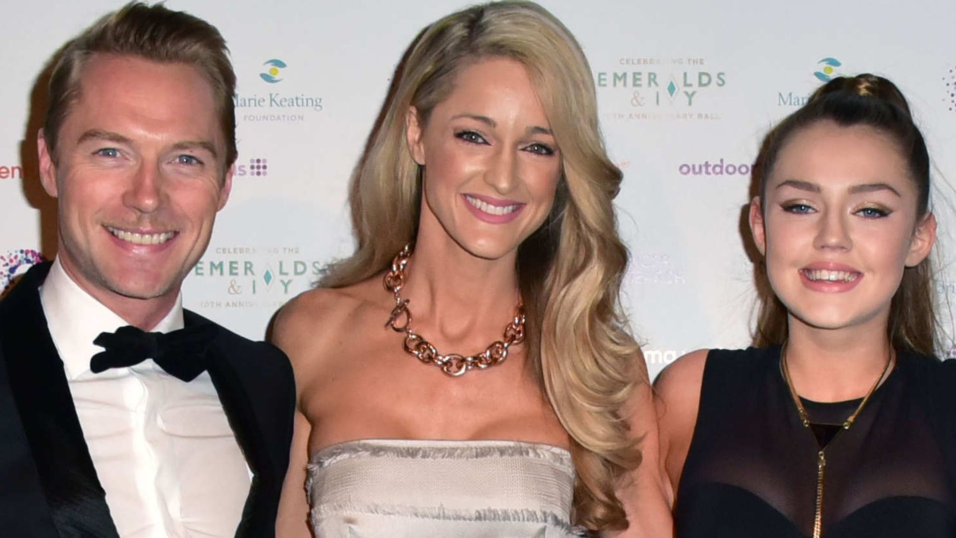 Ronan Keating in a suit with Storm Keating and Missy Keating