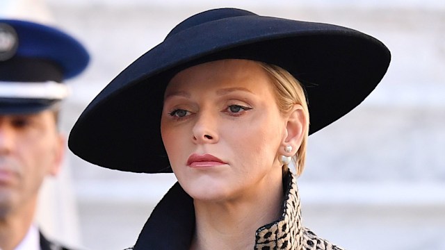 Princess Charlene in printed jacket and big hat
