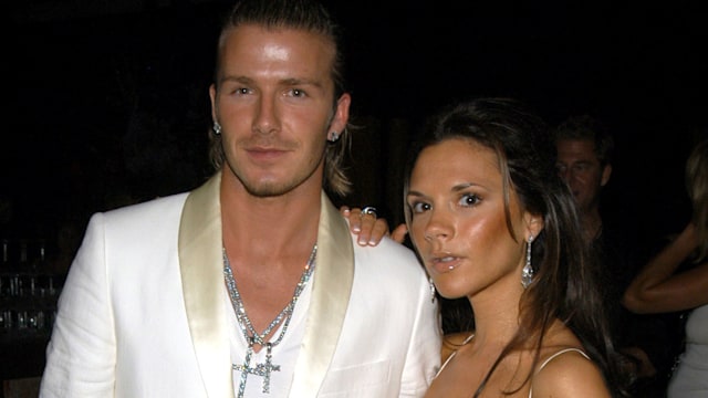 David Beckham and Victoria Beckham in matching white and silver outfits at the The Shrine Auditorium 
