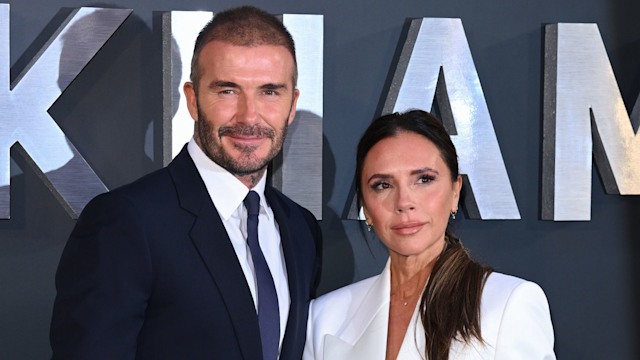 David Beckham in blue suit with Victoria Beckham in a white suit