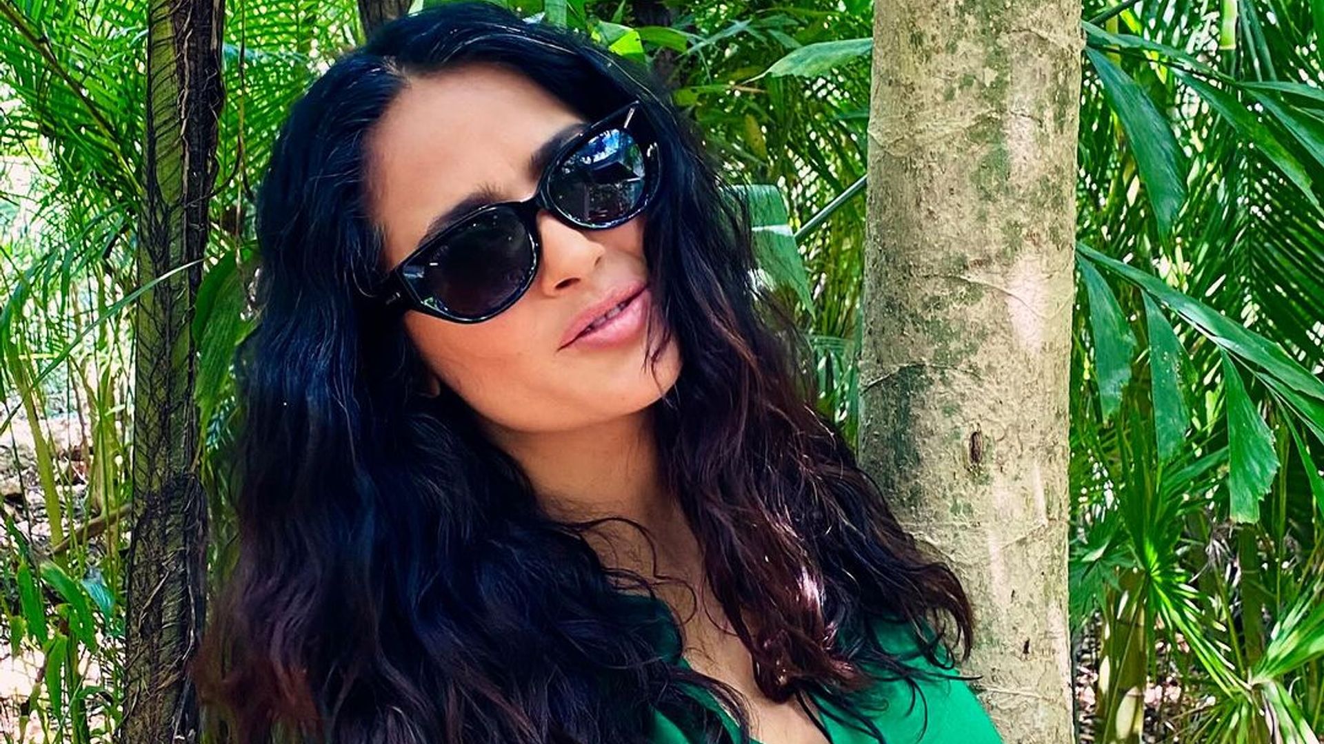 Salma Hayek hugs a tree as she joins the celebrities honoring Earth Day