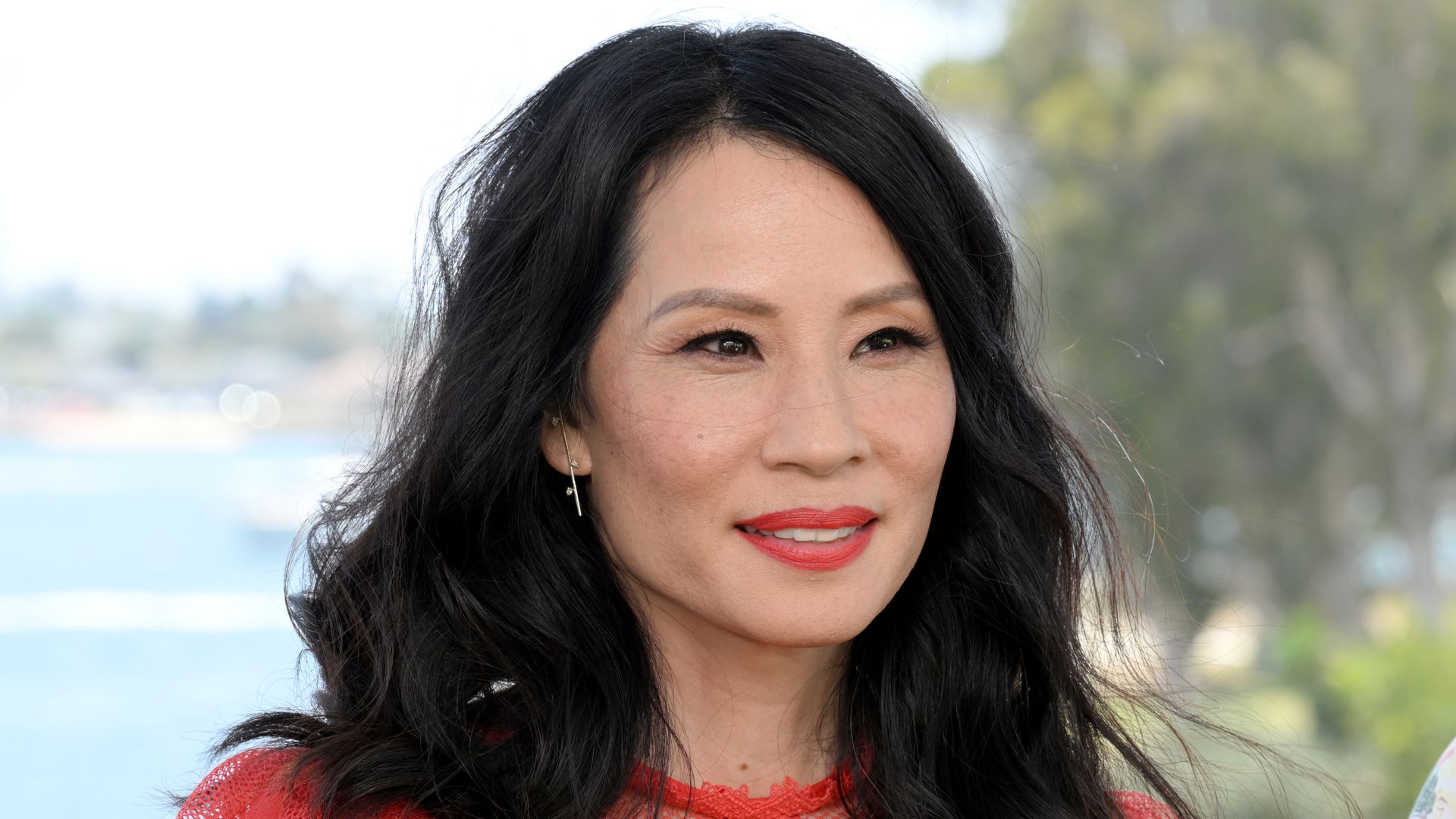 Lucy Liu in red dress at IMDboat At San Diego Comic-Con 2022