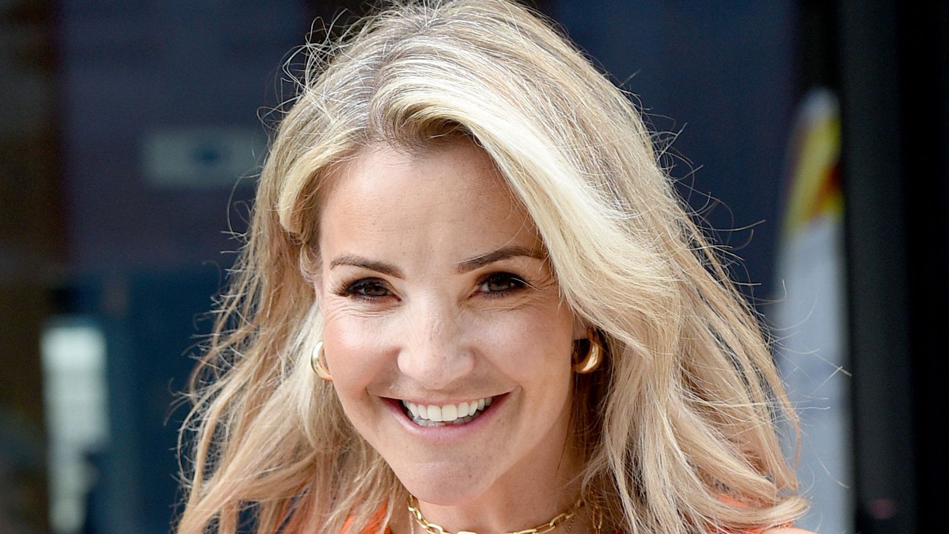 helen skelton walking in orange dress