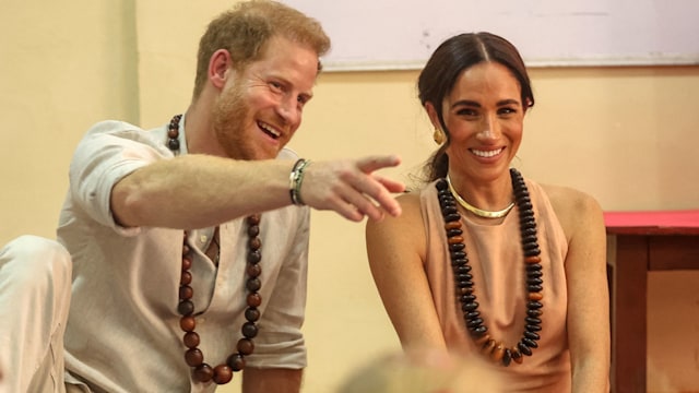 Prince Harry and Meghan Markle in a classroom