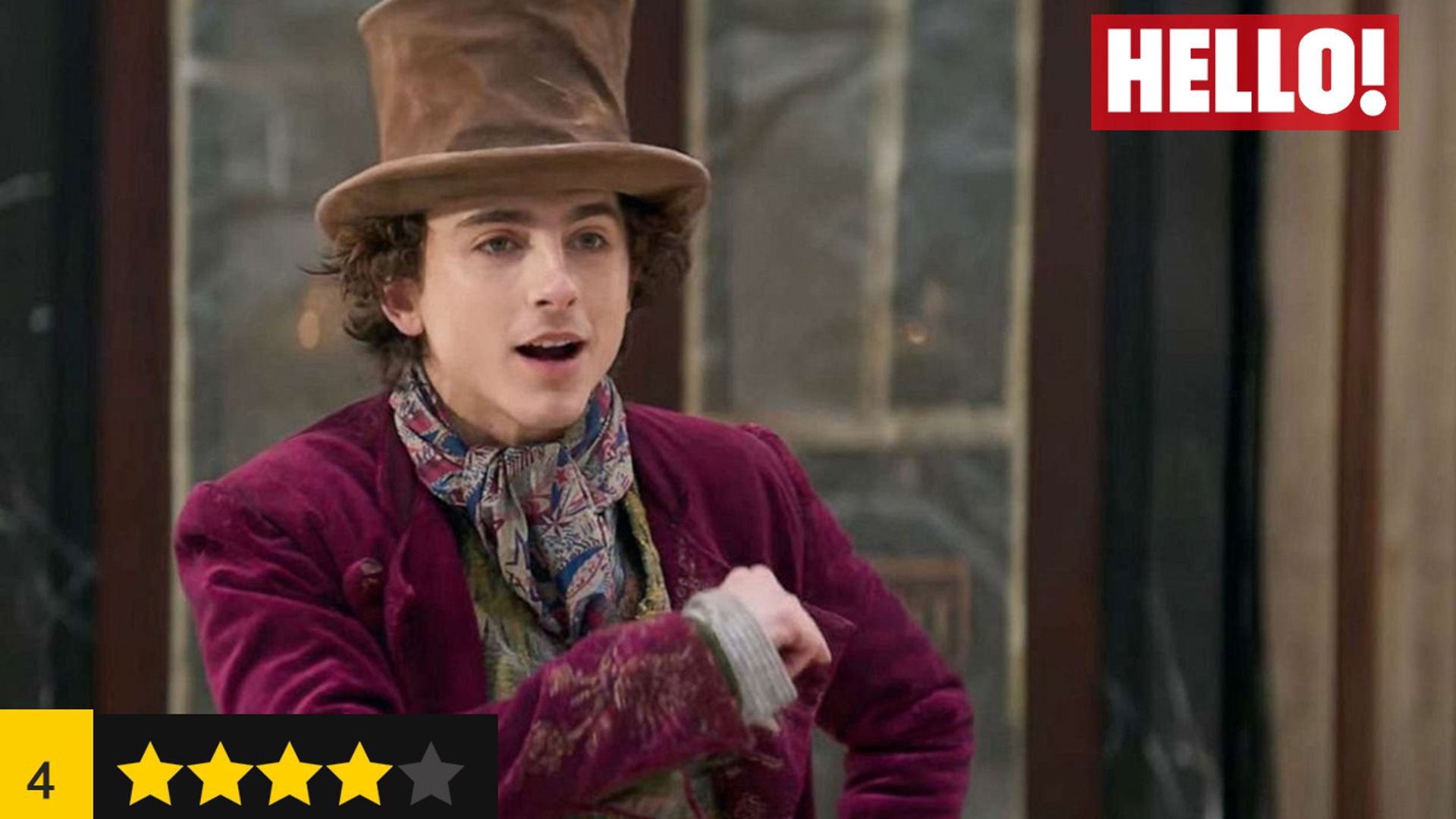 Timothee Chalamet poses in character as Willy Wonka, there are four stars in the bottom left 