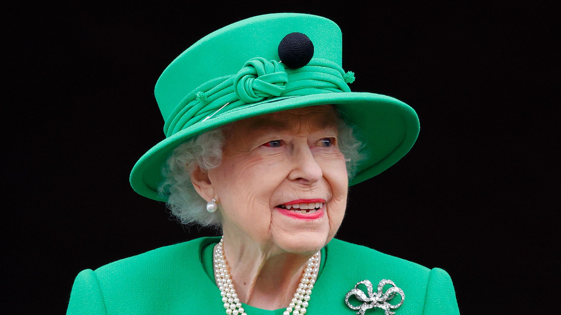 Queen Elizabeth II in a green outfit