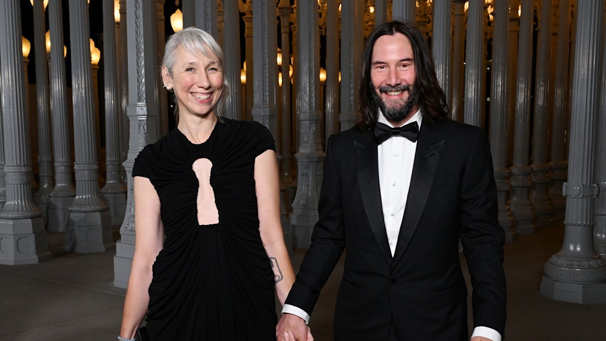 Keanu Reeves' girlfriend shows off diamond ring on wedding finger as couple pack on PDA