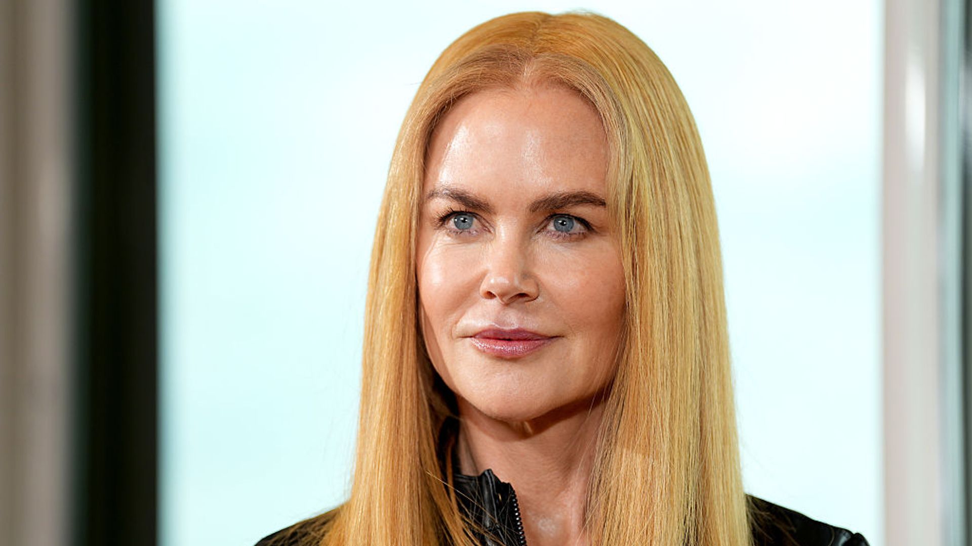 Nicole Kidman with blonde hair looking straight to camera 