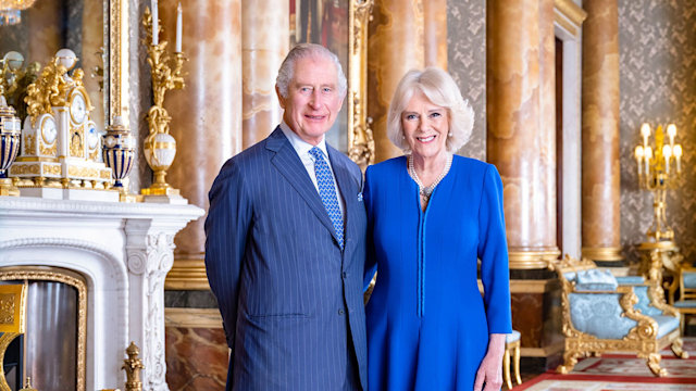 The King and Queen Consort pose for a portrait in the blue drawing room at Buckingham Palace