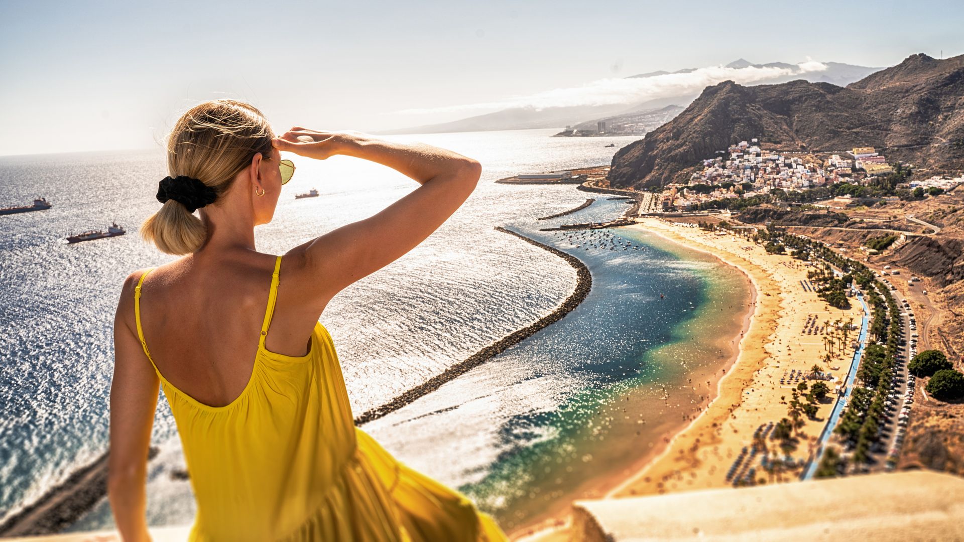 Woman looking at the landscape of Las Teresitas beach and San Andres village, Tenerife, Canary Islands, Spain.