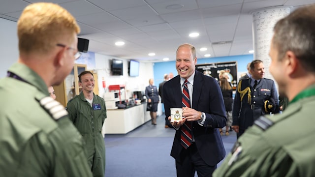 Prince William talks to RAF personnel during an official visit at RAF Valley