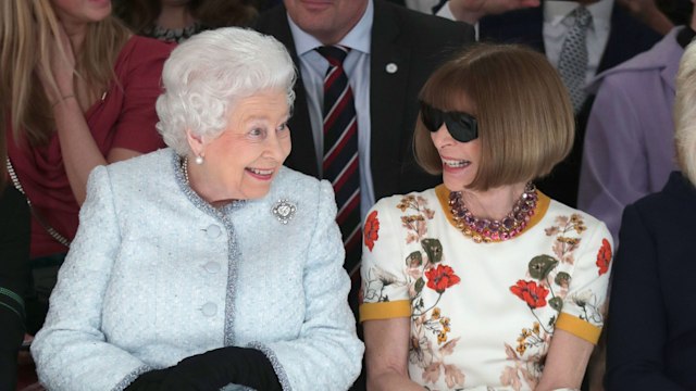Queen Elizabeth and Anna Wintour smile as they sit front row at Richard Quinn's runway show in London.