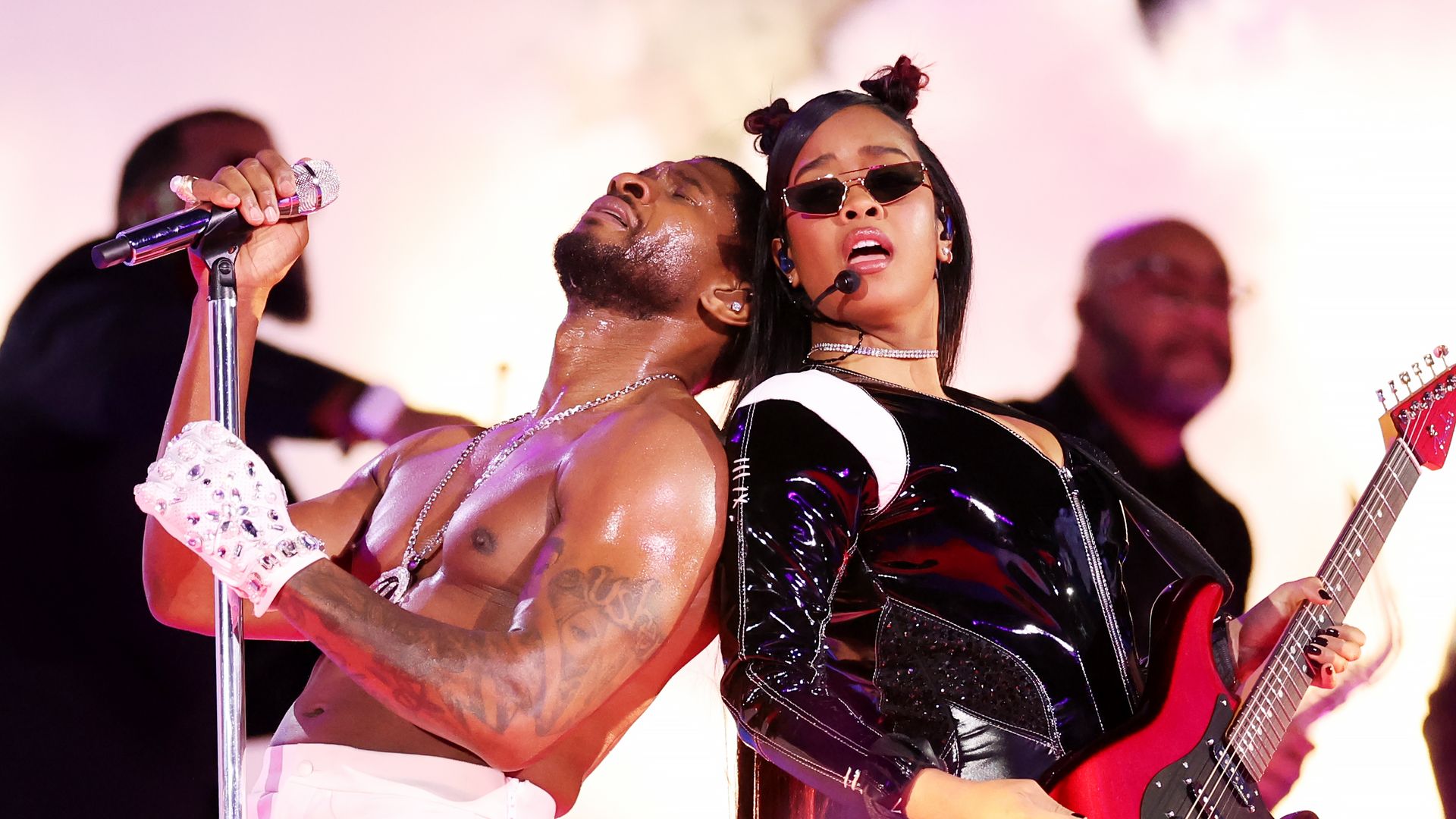 Usher and H.E.R. perform onstage during the Apple Music Super Bowl LVIII Halftime Show at Allegiant Stadium on February 11, 2024 in Las Vegas, Nevada