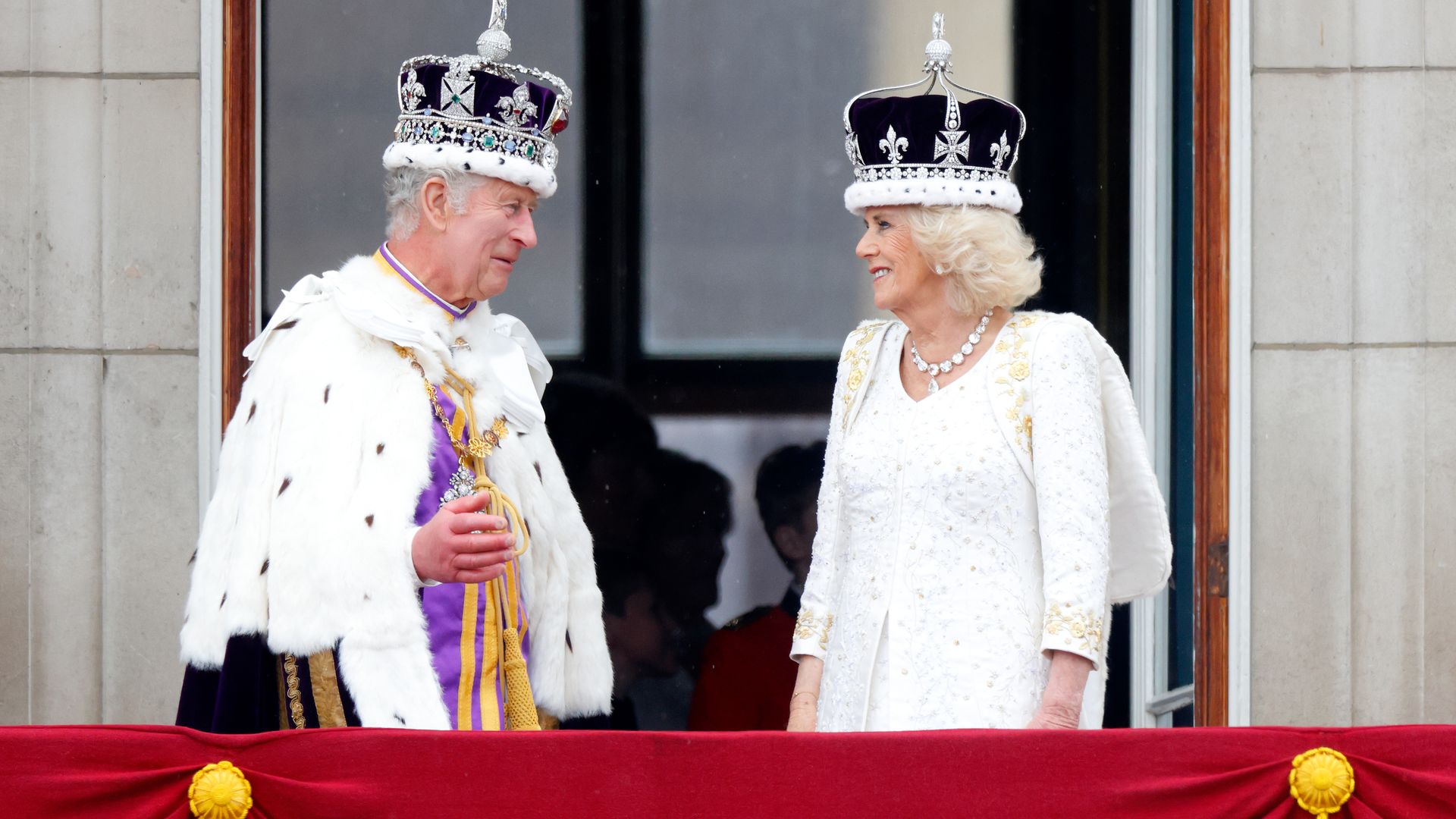 King Charles III and Queen Camilla watch an RAF flypast from the balcony of Buckingham Palace following their coronation at Westminster Abbey on May 6, 2023 in London, England. The Coronation of Charles III and his wife, Camilla, as King and Queen of the 